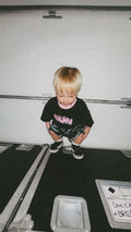 rockstar kid with camo shorts